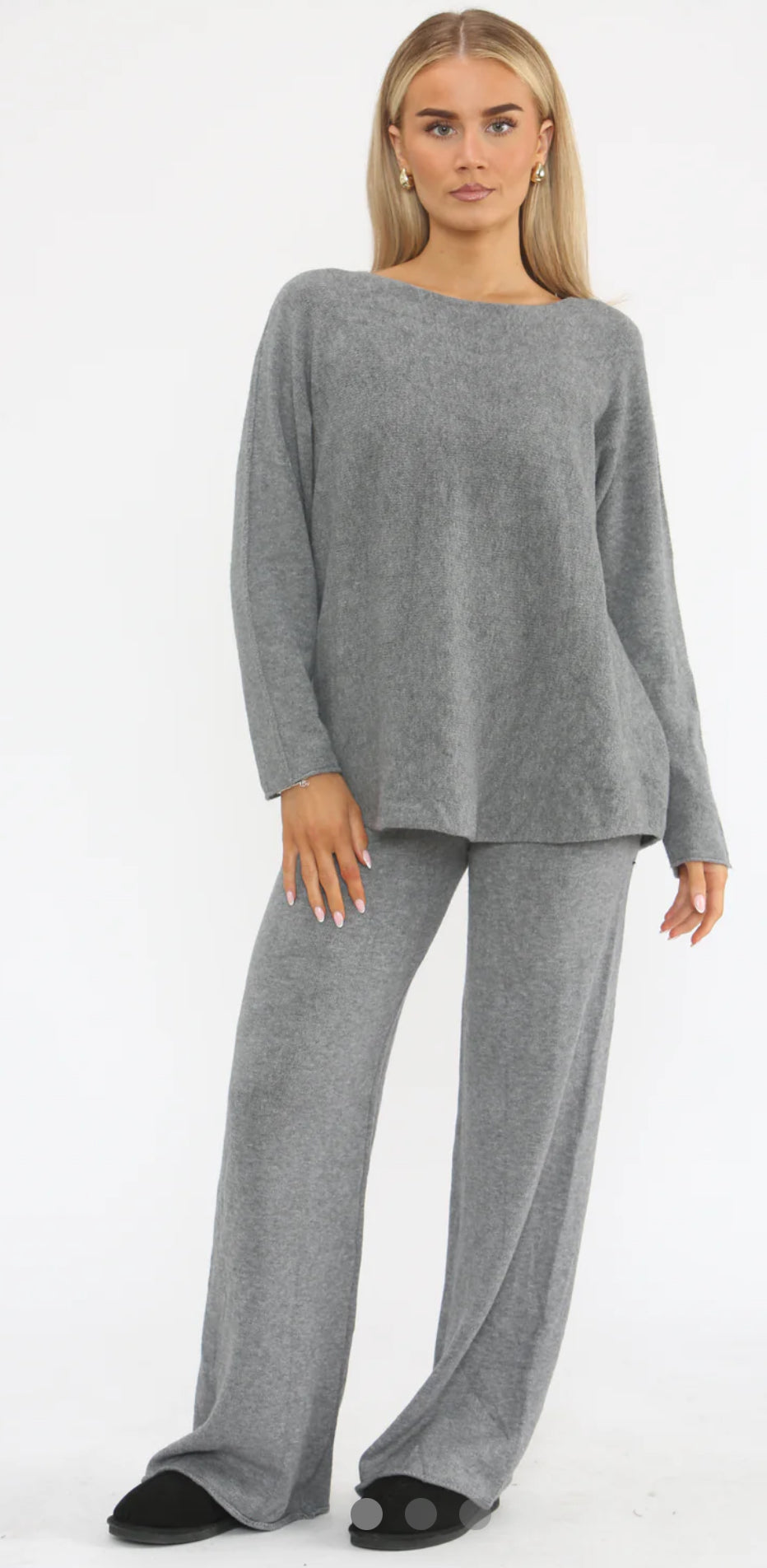 Woman wearing a gray outfit on a white background