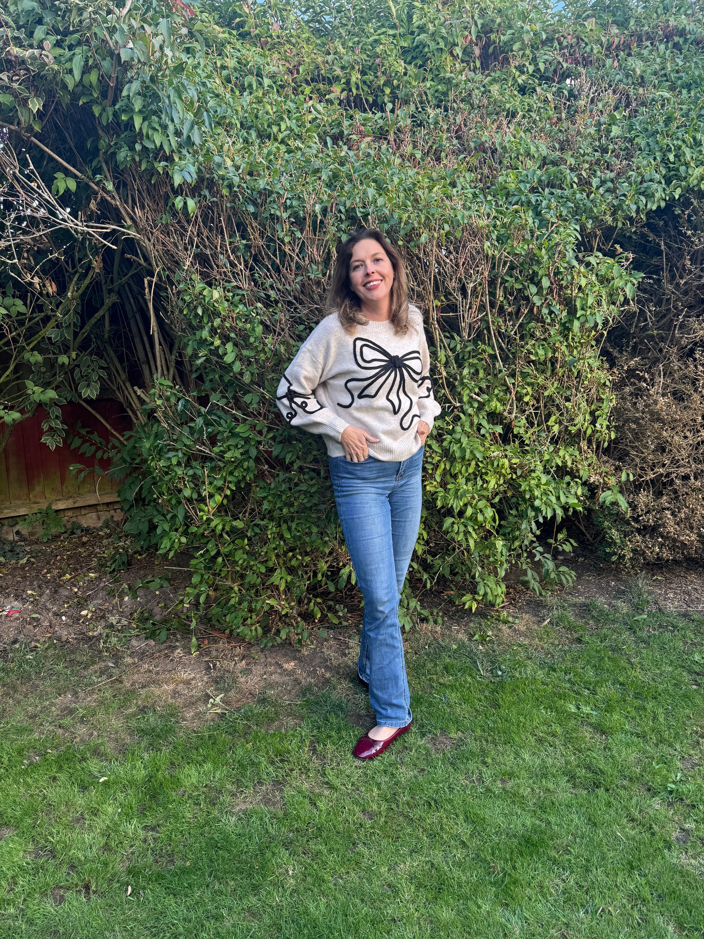 Embroidered bow jumper