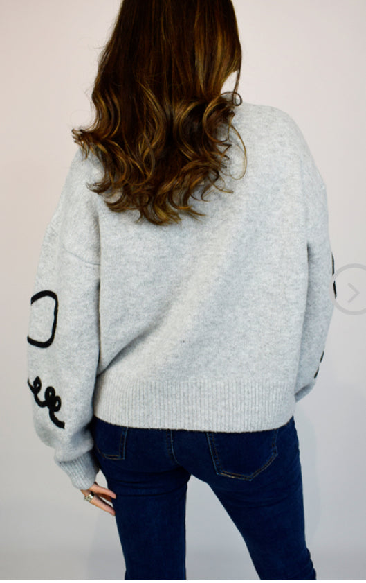 Embroidered bow jumper