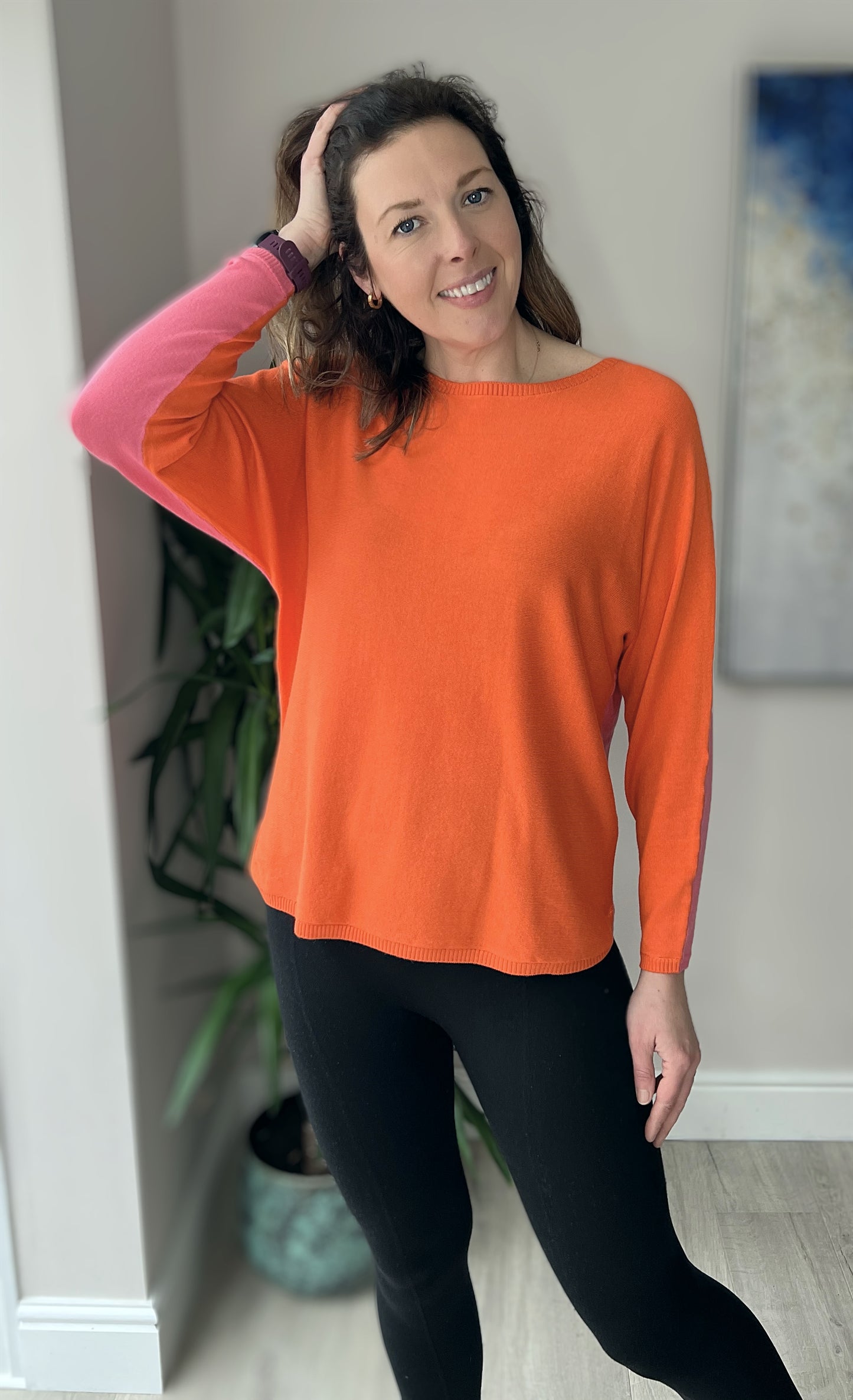 Knitted pullover in orange and pink