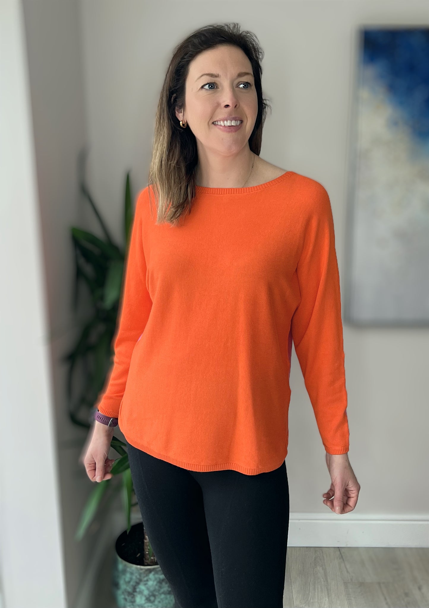 Knitted pullover in orange and pink